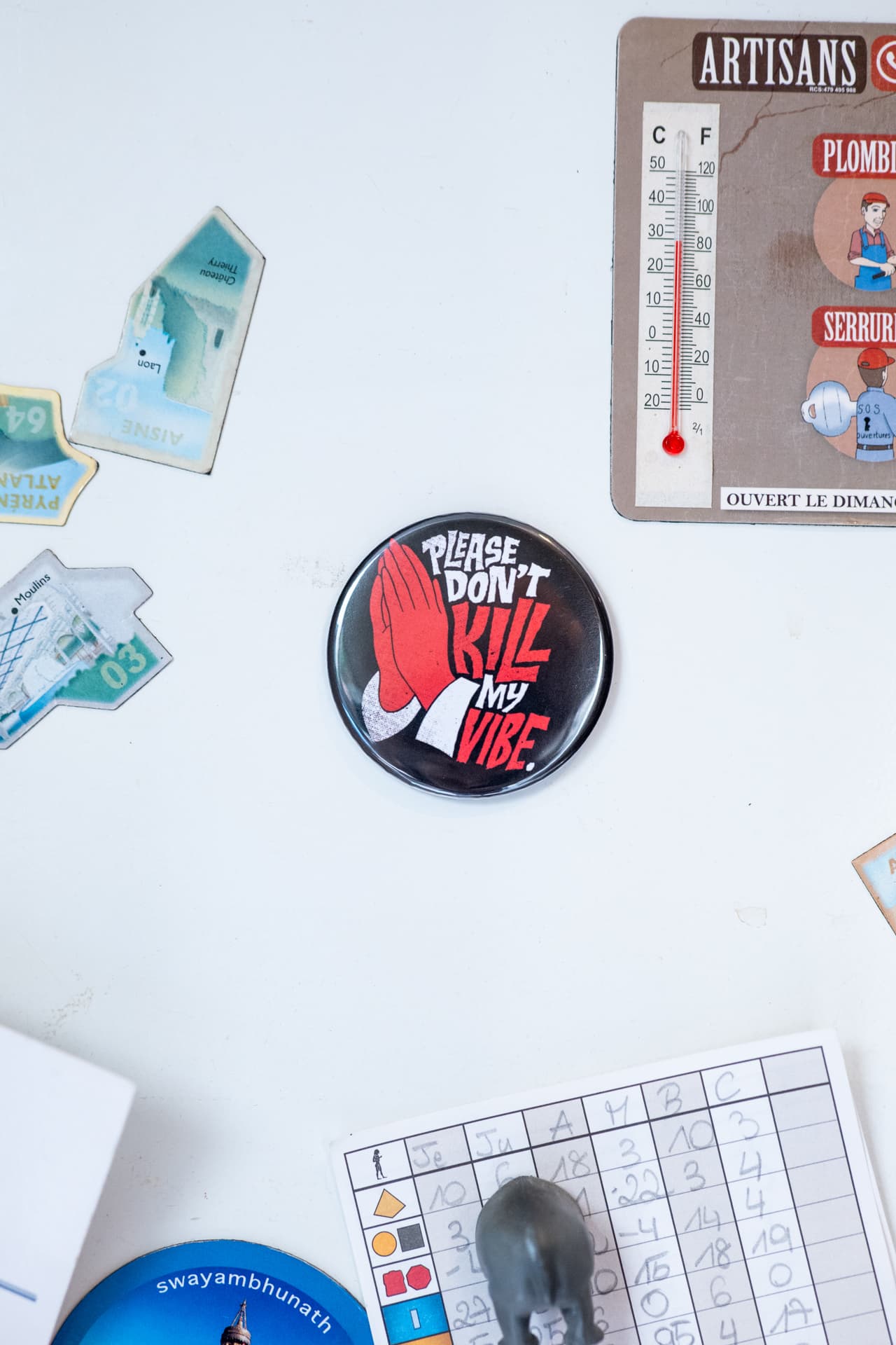Custom magnetic bottle opener attached to a metal surface
