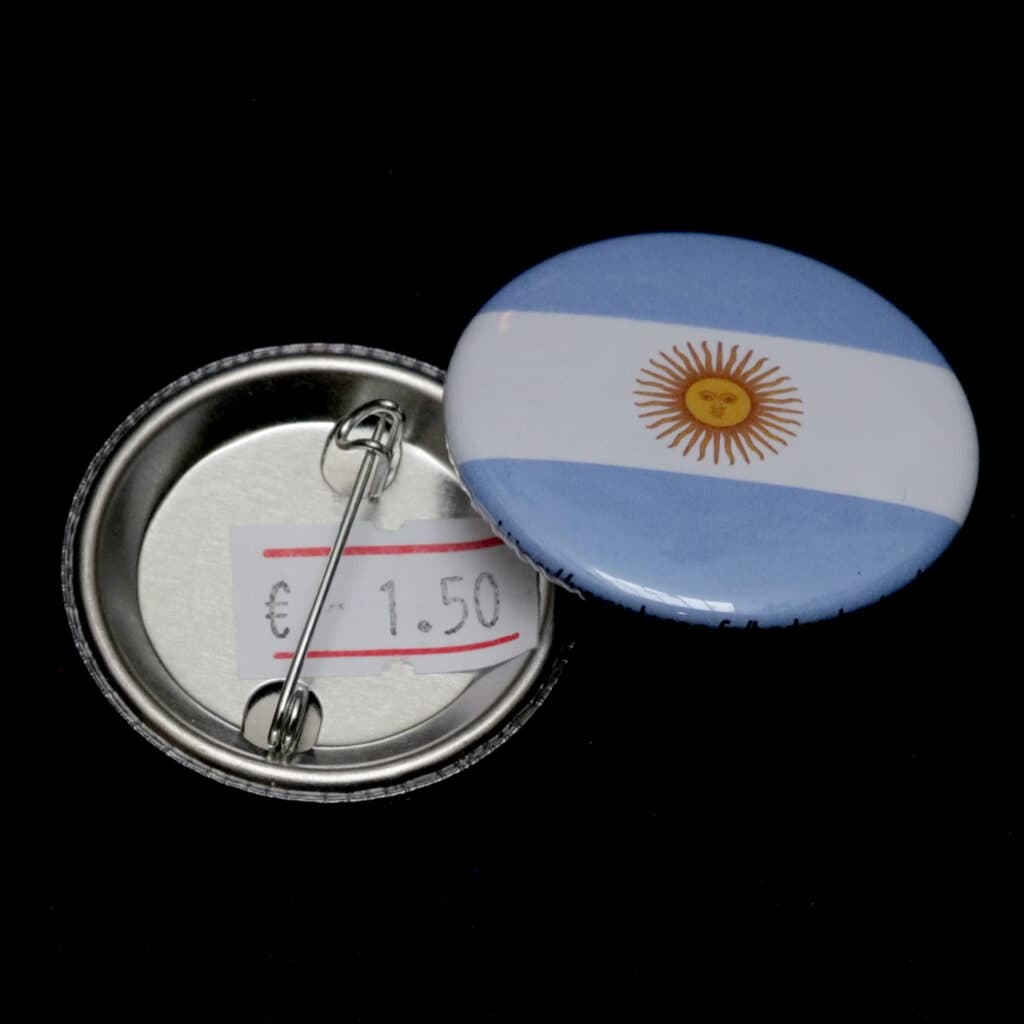 Detailed view of a round 38mm custom badge