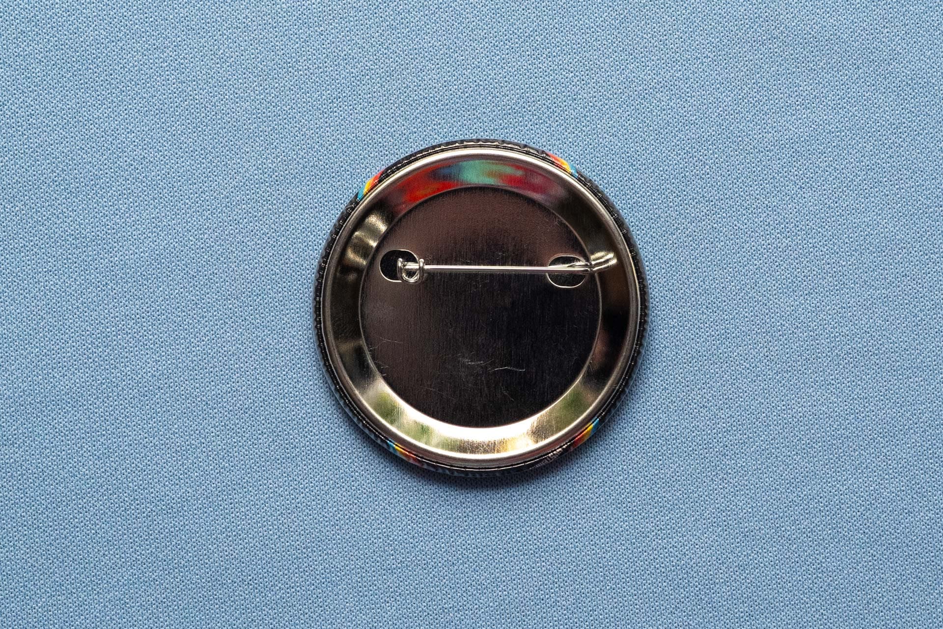 Close view of printed 56mm button badges