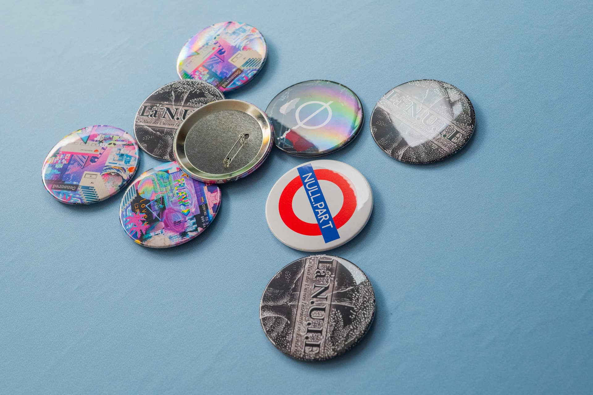 Large 88mm custom button badges with illustrated designs