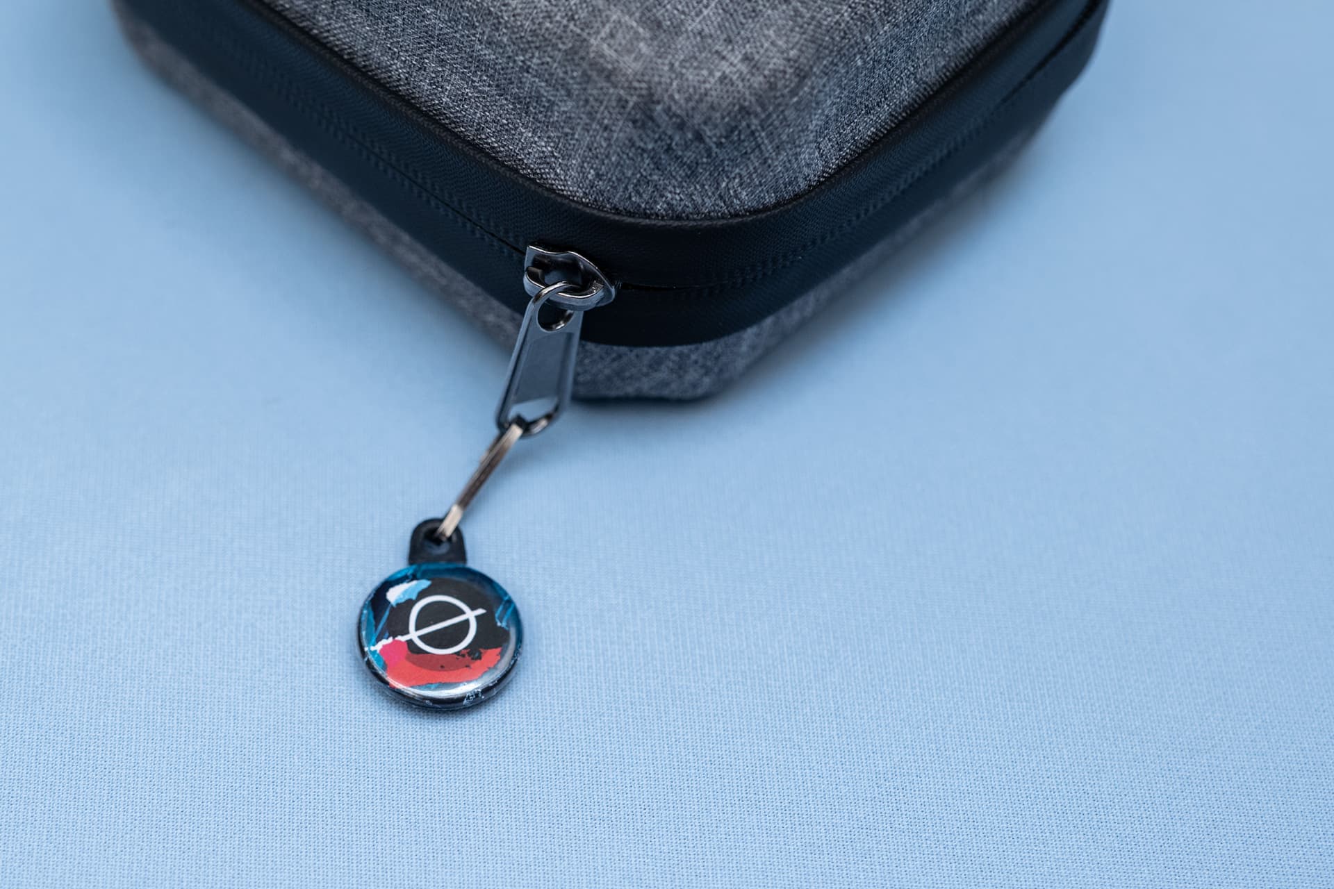 Detail of a personalised zipper pull and metal loop